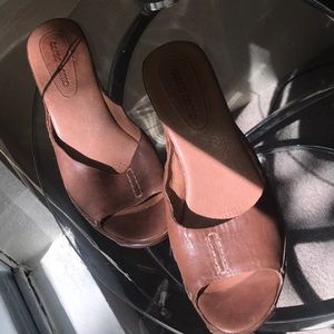 Brown heeled summer shoes.